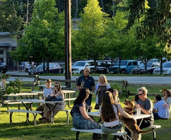Families and friends eating outside at Bonsai Brewery in Whitefish